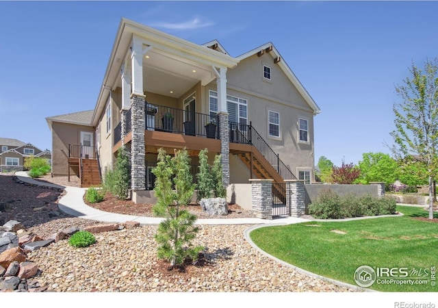 4843 Mariana Hills Cir, Loveland, CO 80537 - rear view of property with stairway, stucco siding, and a gate