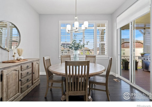 4843 Mariana Hills Cir, Loveland, CO 80537 - dining room with baseboards, dark wood finished floors, and a chandelier