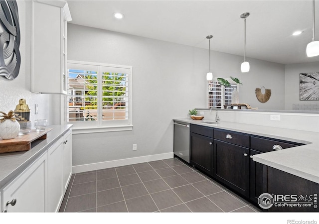 4843 Mariana Hills Cir, Loveland, CO 80537 - kitchen featuring a sink, white cabinets, dishwasher, baseboards, and light countertops