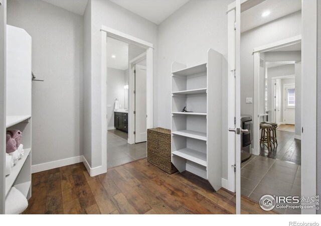 4843 Mariana Hills Cir, Loveland, CO 80537 - walk in closet featuring dark wood-style floors