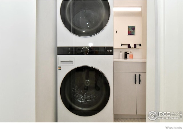 washroom with stacked washing machine and dryer