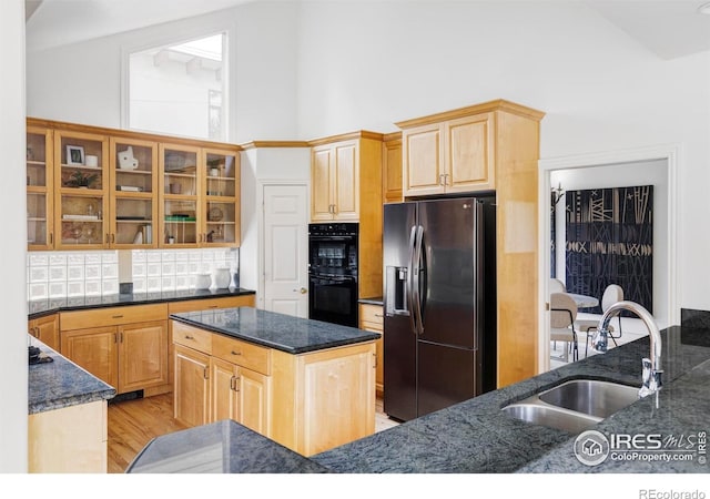 910 Kalmia Ave, Boulder, CO 80304 - kitchen with fridge with ice dispenser, a sink, decorative backsplash, light brown cabinetry, and light wood-style flooring