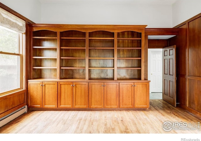 910 Kalmia Ave, Boulder, CO 80304 - unfurnished office with light wood-type flooring and a baseboard radiator