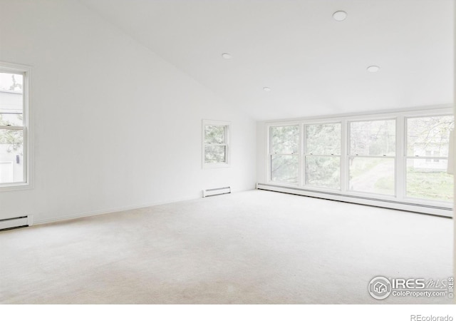 910 Kalmia Ave, Boulder, CO 80304 - unfurnished living room with healthy amount of natural light, carpet flooring, a baseboard radiator, a baseboard heating unit, and vaulted ceiling
