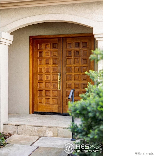 910 Kalmia Ave, Boulder, CO 80304 - doorway to property with stucco siding