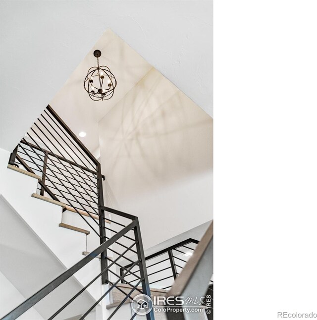 2017 Vaquero St, Longmont, CO 80504 - stairs with a chandelier