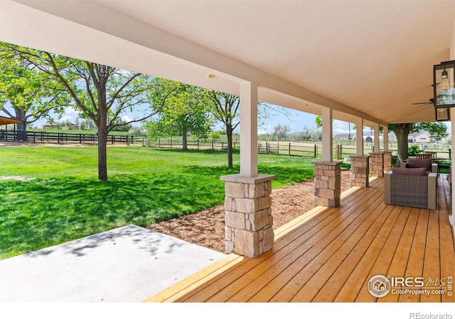 2017 Vaquero St, Longmont, CO 80504 - wooden deck with ceiling fan and a rural view