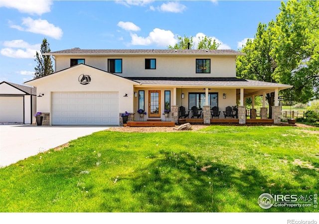 2017 Vaquero St, Longmont, CO 80504 - view of front of property with stucco siding, a porch, a front lawn, a garage, and driveway