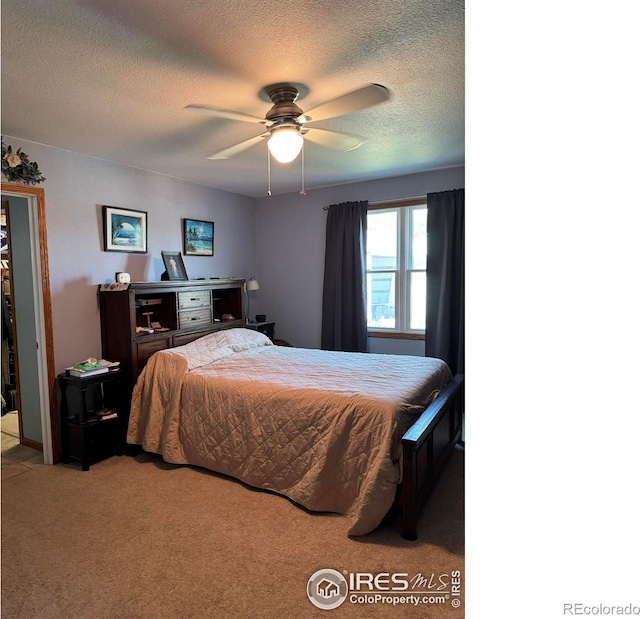 841 Dexter St, Wray, CO 80758 - carpeted bedroom featuring a textured ceiling and ceiling fan