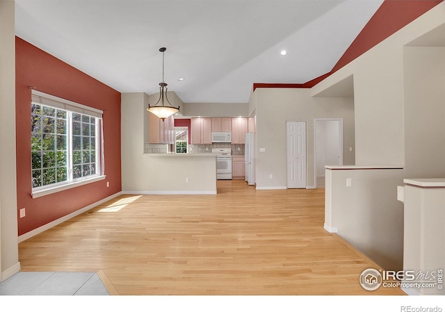 3742 Florentine Cir, Longmont, CO 80503 - kitchen with white appliances, light wood-style flooring, light countertops, backsplash, and decorative light fixtures