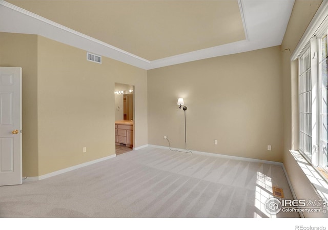 3742 Florentine Cir, Longmont, CO 80503 - unfurnished bedroom with light carpet, baseboards, ensuite bath, and crown molding