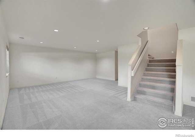 3742 Florentine Cir, Longmont, CO 80503 - below grade area featuring carpet floors, recessed lighting, baseboards, and stairs