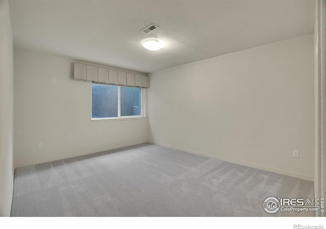 3742 Florentine Cir, Longmont, CO 80503 - carpeted spare room featuring baseboards and a textured ceiling