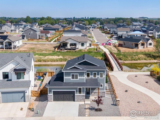 aerial view of residential area with a nearby body of water