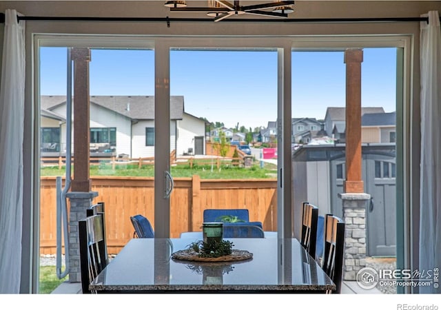 dining space featuring a residential view