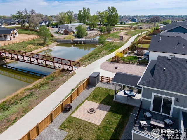 aerial perspective of suburban area with a nearby body of water