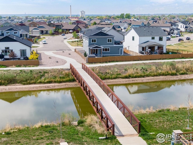 aerial view of residential area with a nearby body of water