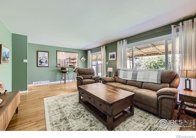 living room with wood finished floors and baseboards