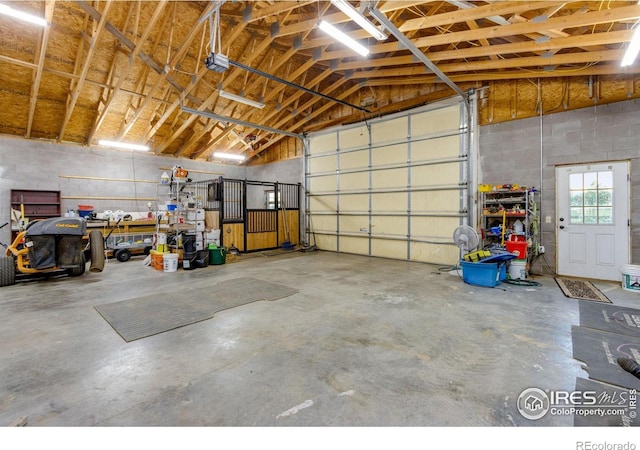 garage with concrete block wall