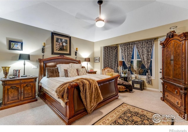 bedroom with light carpet and a ceiling fan