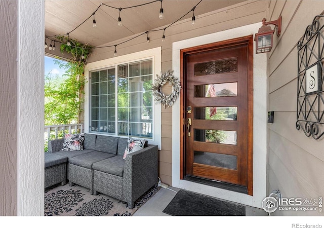 property entrance with covered porch