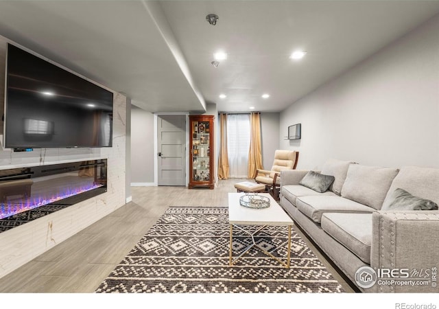 living room with wood finished floors and recessed lighting