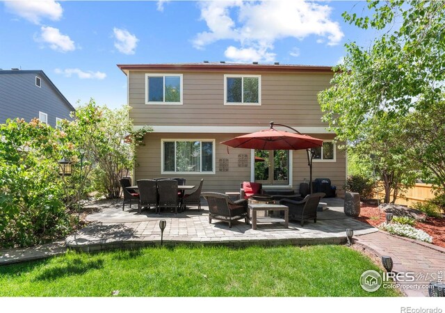 rear view of house featuring a patio area
