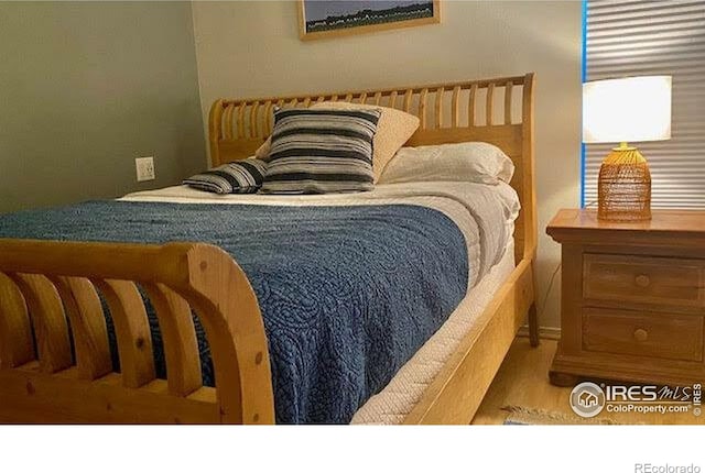 bedroom featuring wood finished floors