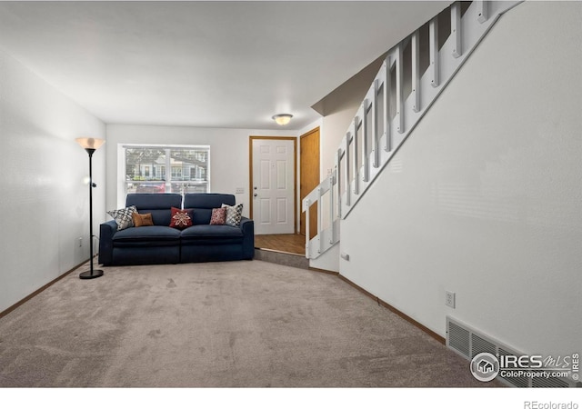 504 Shady Crest Cir, Colorado Springs, CO 80916 - living area featuring carpet, baseboards, and stairs