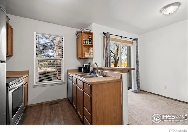 504 Shady Crest Cir, Colorado Springs, CO 80916 - kitchen with appliances with stainless steel finishes, a sink, healthy amount of natural light, and open shelves