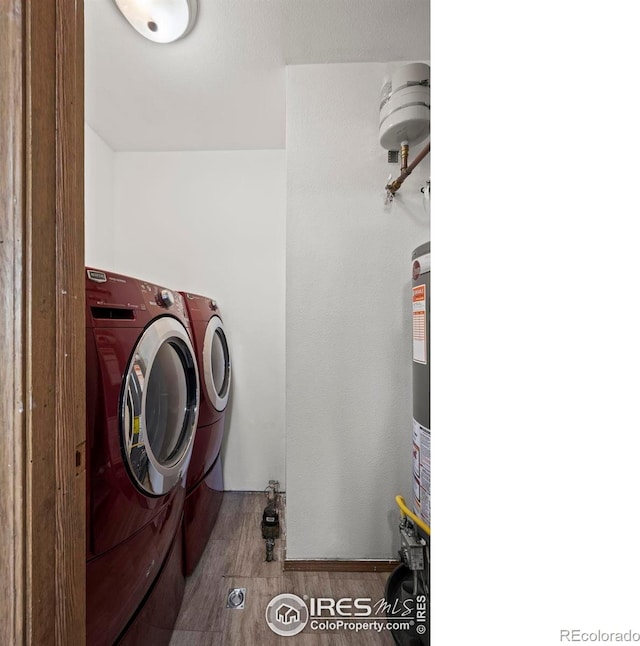 504 Shady Crest Cir, Colorado Springs, CO 80916 - clothes washing area featuring washing machine and clothes dryer and wood finished floors