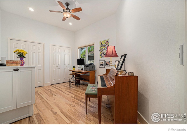 office space featuring light wood finished floors, ceiling fan, recessed lighting, and baseboards