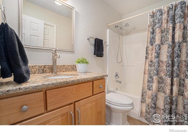 full bathroom with vanity, tile patterned floors, toilet, and shower / bath combo