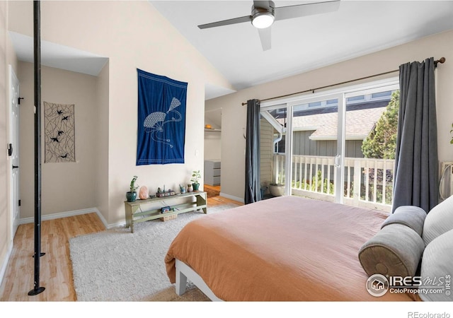 bedroom with vaulted ceiling, wood finished floors, access to outside, baseboards, and ceiling fan