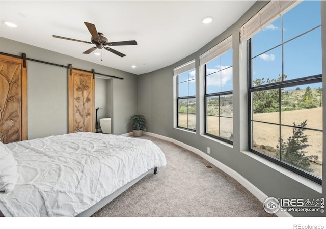 2118 Dry Creek Dr, Lyons, CO 80540 - bedroom with a barn door, carpet floors, baseboards, recessed lighting, and ceiling fan