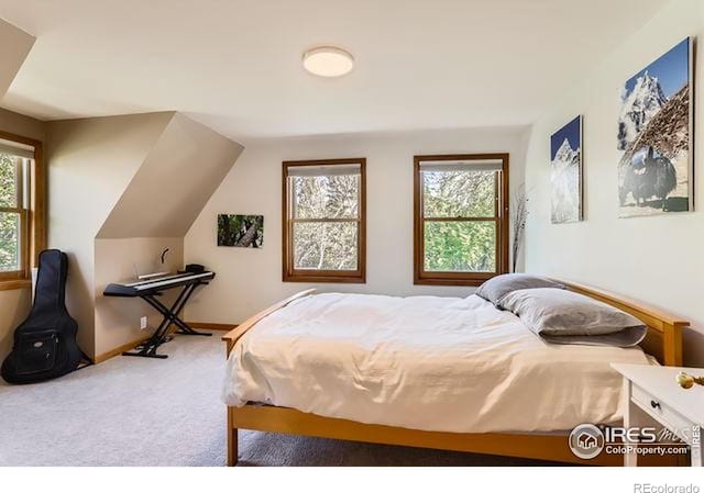 carpeted bedroom with baseboards