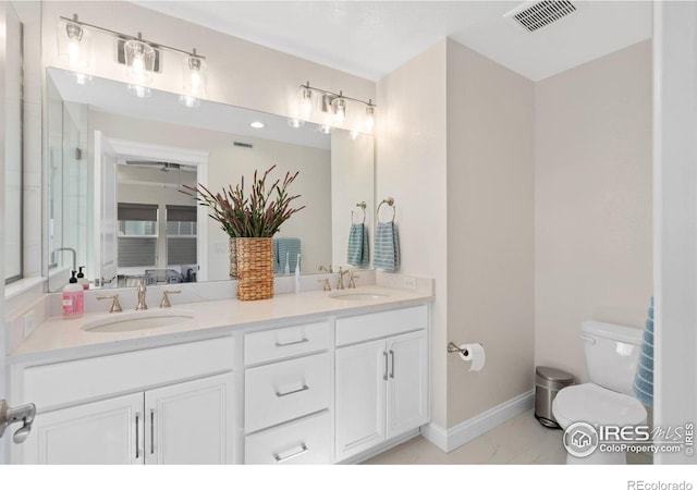 97 Westerly Blvd, Erie, CO 80516 - full bath with marble finish floors, toilet, double vanity, baseboards, and a shower with shower door
