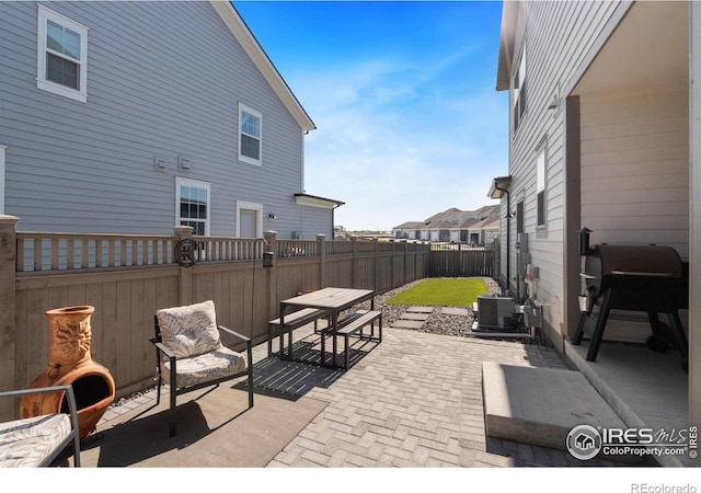 97 Westerly Blvd, Erie, CO 80516 - view of patio / terrace with central AC and a fenced backyard
