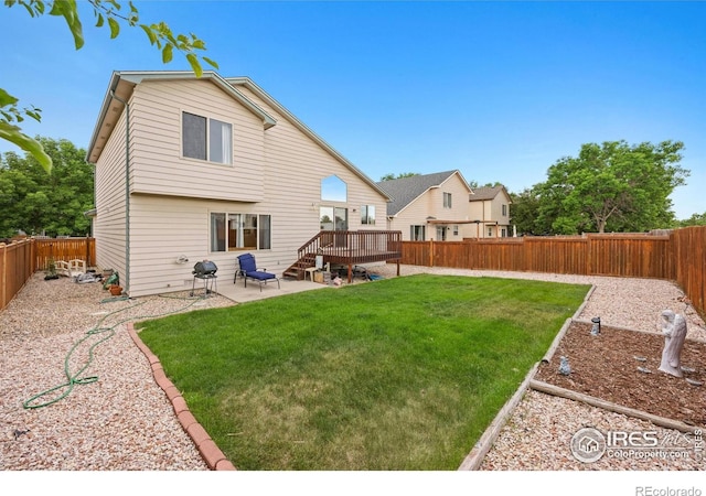 3949 Willowood Ave, Loveland, CO 80538 - back of property featuring a wooden deck and a patio area