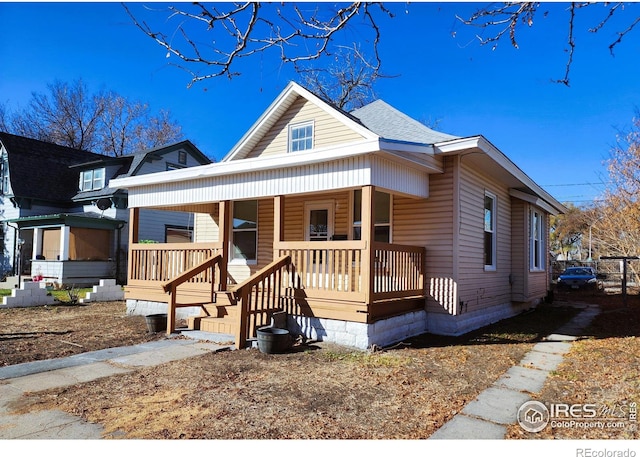 view of front of home featuring a porch and a shingled roof