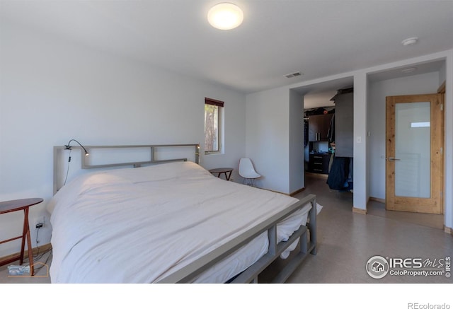 548 Coughlin Meadows Rd, Boulder, CO 80302 - bedroom with a walk in closet, baseboards, and a closet