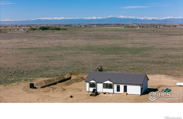 view of rural area with a mountain backdrop