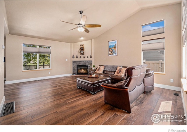 8962 Smoke Signal Way, Wellington, CO 80549 - living area featuring vaulted ceiling, ceiling fan, wood finished floors, a fireplace, and baseboards