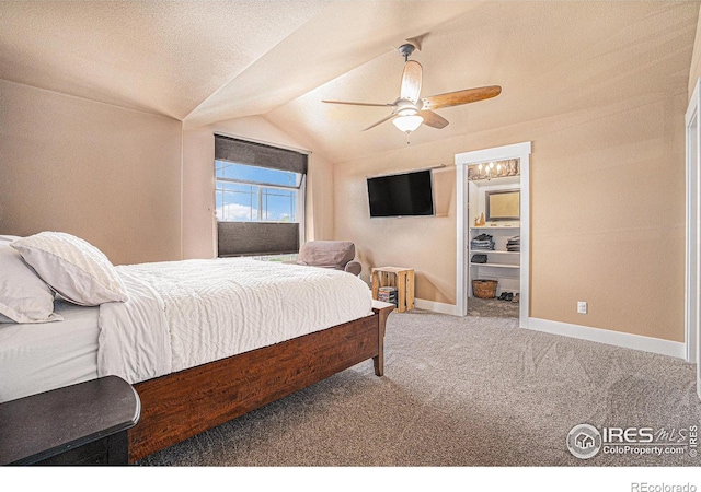 8962 Smoke Signal Way, Wellington, CO 80549 - bedroom featuring vaulted ceiling, carpet flooring, baseboards, and a ceiling fan