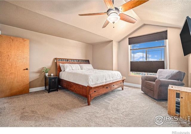8962 Smoke Signal Way, Wellington, CO 80549 - carpeted bedroom featuring vaulted ceiling, baseboards, and ceiling fan