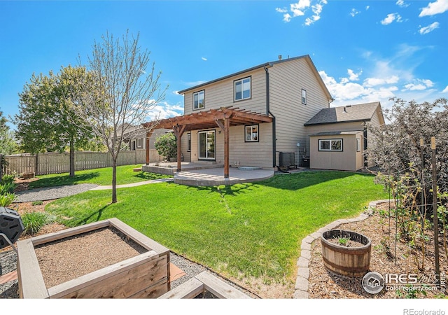 8962 Smoke Signal Way, Wellington, CO 80549 - rear view of property featuring a pergola, a garden, a patio area, and central AC