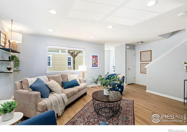 1014 Andrews Peak Dr Unit B107, Fort Collins, CO 80521 - living room with light wood-type flooring, baseboards, stairs, and recessed lighting
