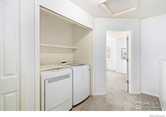 1014 Andrews Peak Dr Unit B107, Fort Collins, CO 80521 - clothes washing area with independent washer and dryer, light carpet, attic access, and baseboards