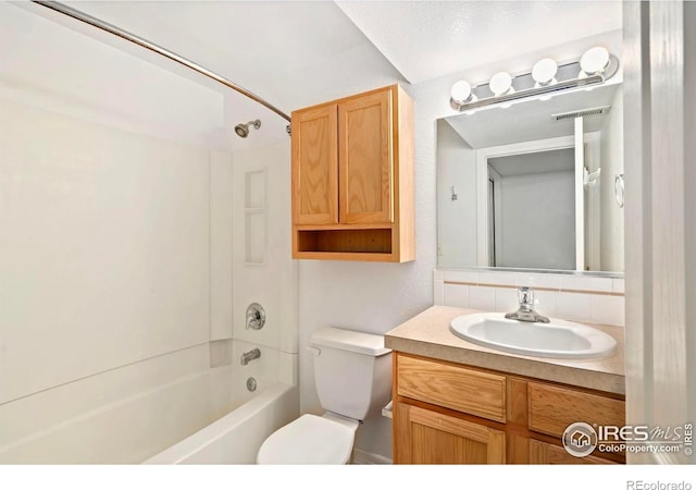 1014 Andrews Peak Dr Unit B107, Fort Collins, CO 80521 - bathroom with vanity, washtub / shower combination, and toilet