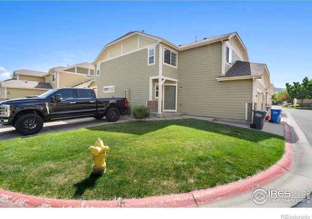 1014 Andrews Peak Dr Unit B107, Fort Collins, CO 80521 - view of front of house featuring a front lawn